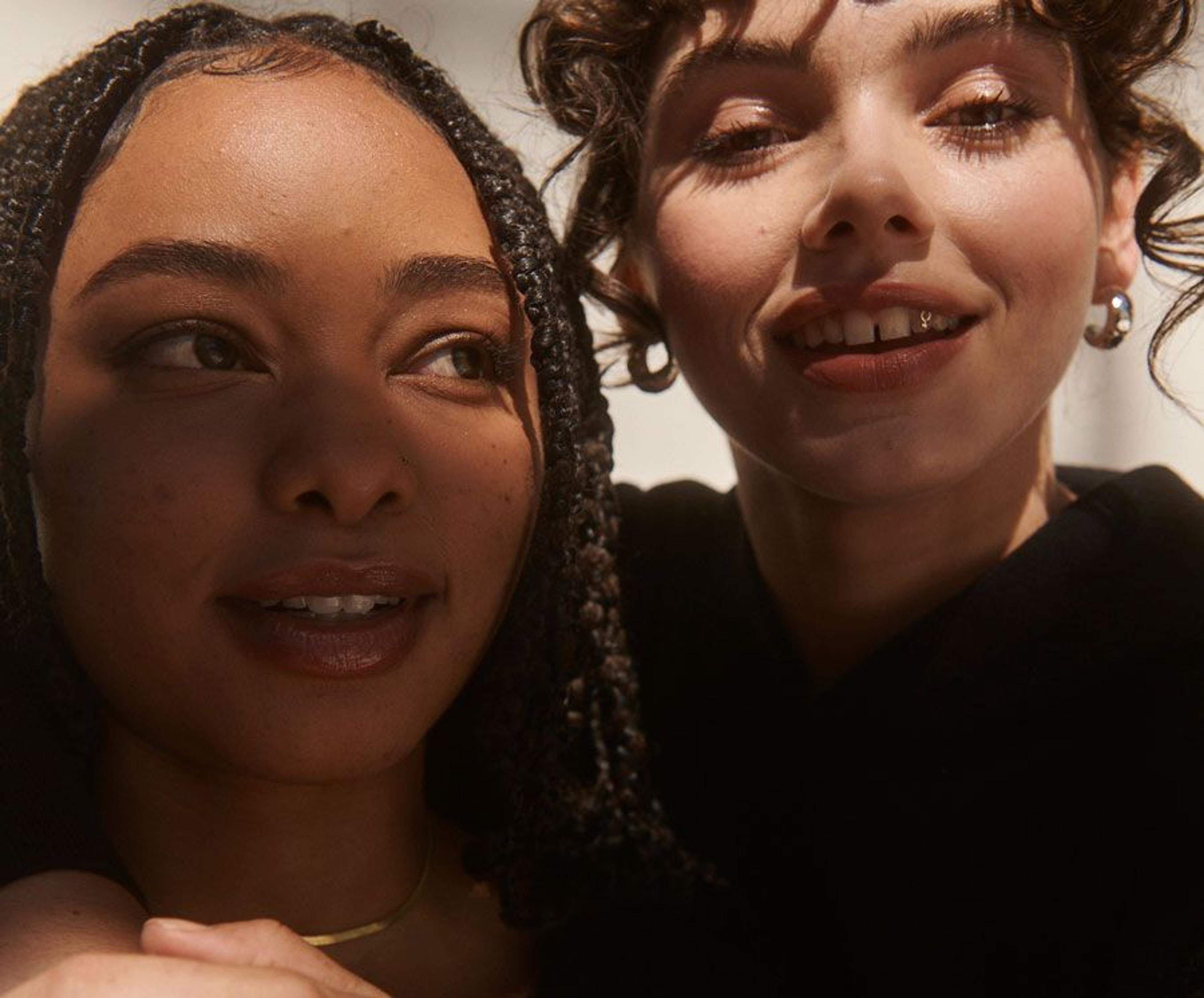 Two girls smiling into the camera